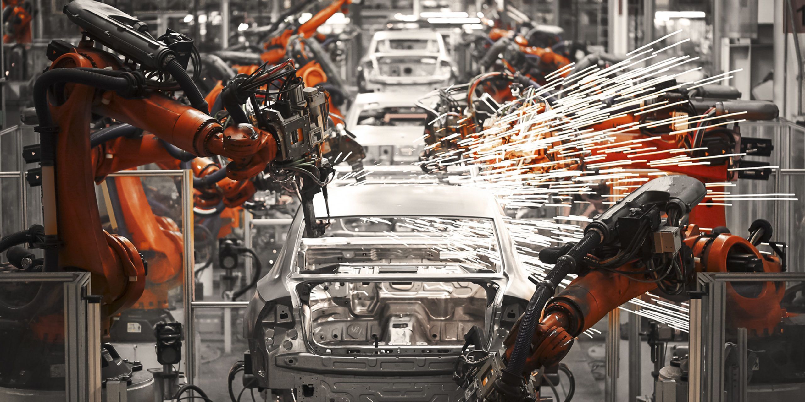 The robotic arm of the car production plant is working